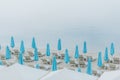 sea ÃÂ¢Ã¢âÂ¬Ã¢â¬Â¹ÃÂ¢Ã¢âÂ¬Ã¢â¬Â¹resort sand beach deck chairs blue umbrellas Royalty Free Stock Photo